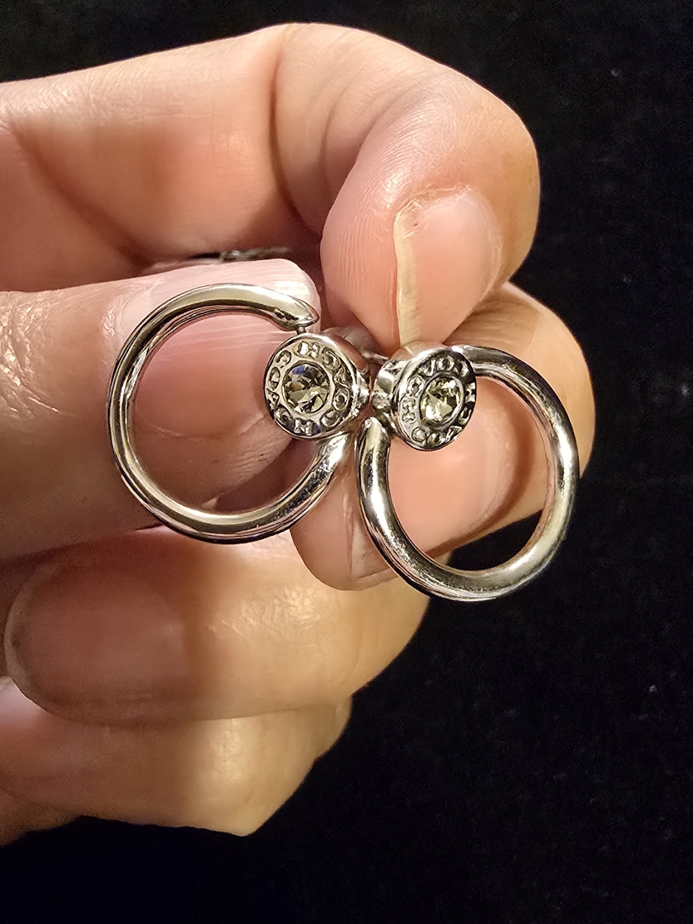 Coach Silver Hoop Earrings with Clear Stone Accents
